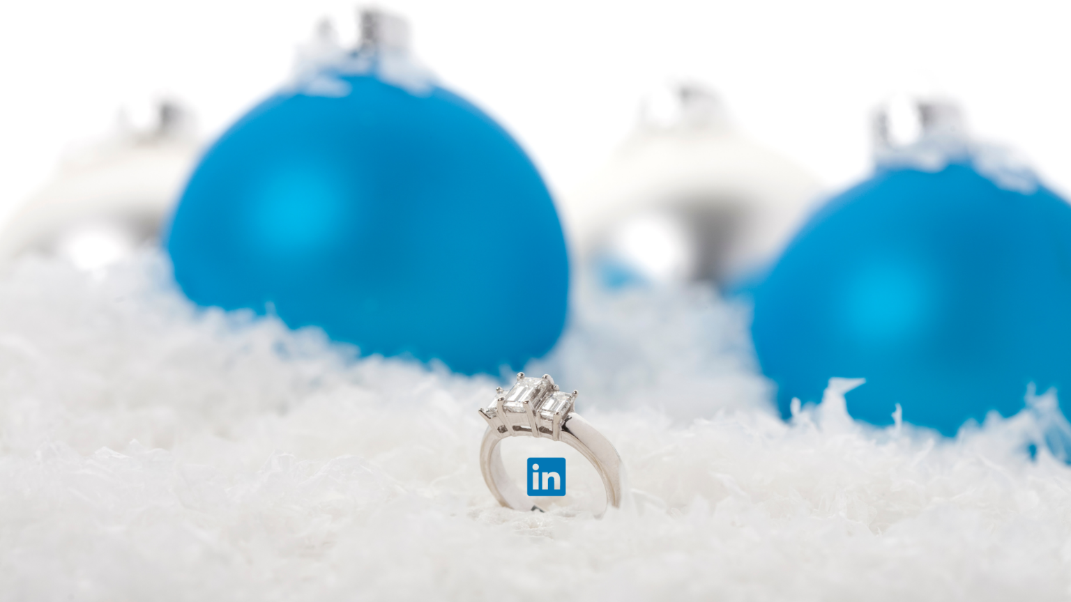 Picture of blue baubles and engagement ring with LinkedIn logo in the middle.