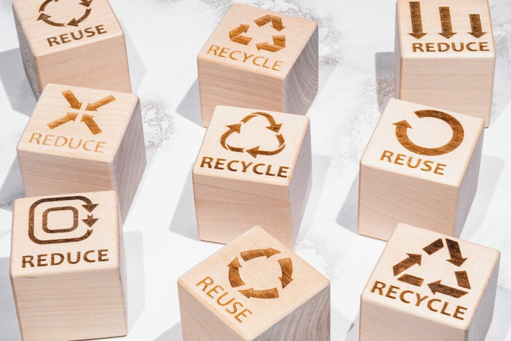 wooden blocks stamped with reuse recycle reduce to promote environmental and sustainable awareness events